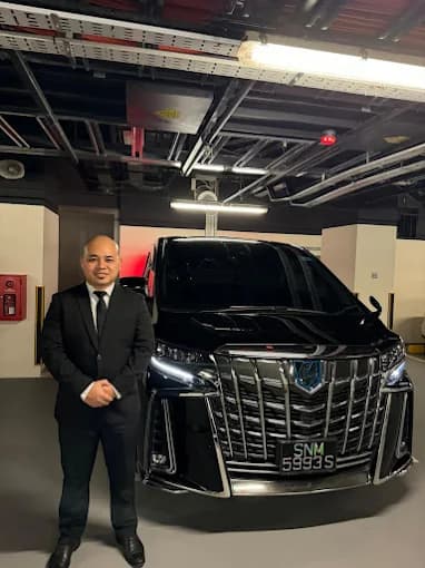 Platinum Maxi Cab professional driver in formal attire